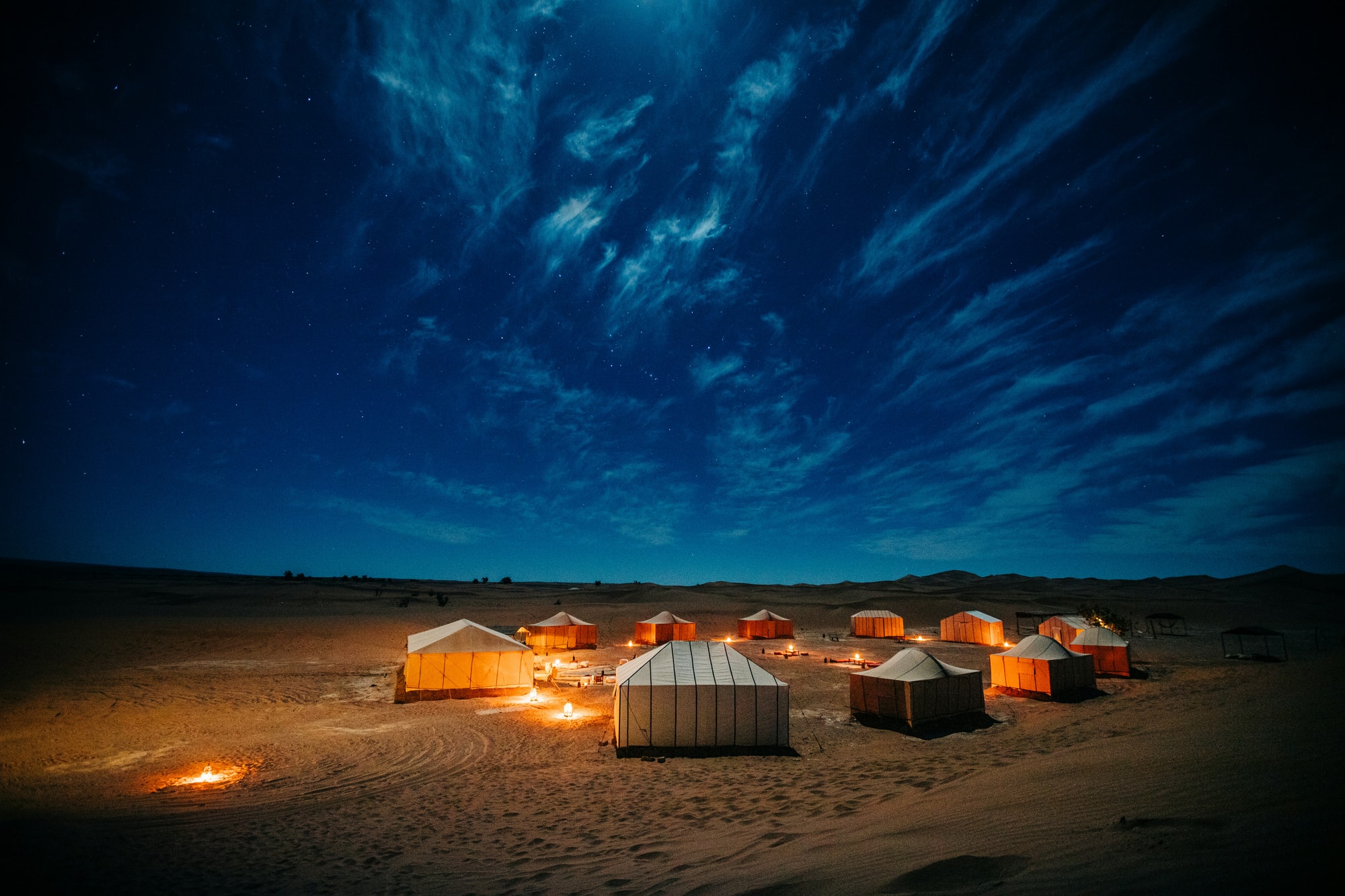 Sahara, Morocco — a desert camp lit beneath a canopy of stars