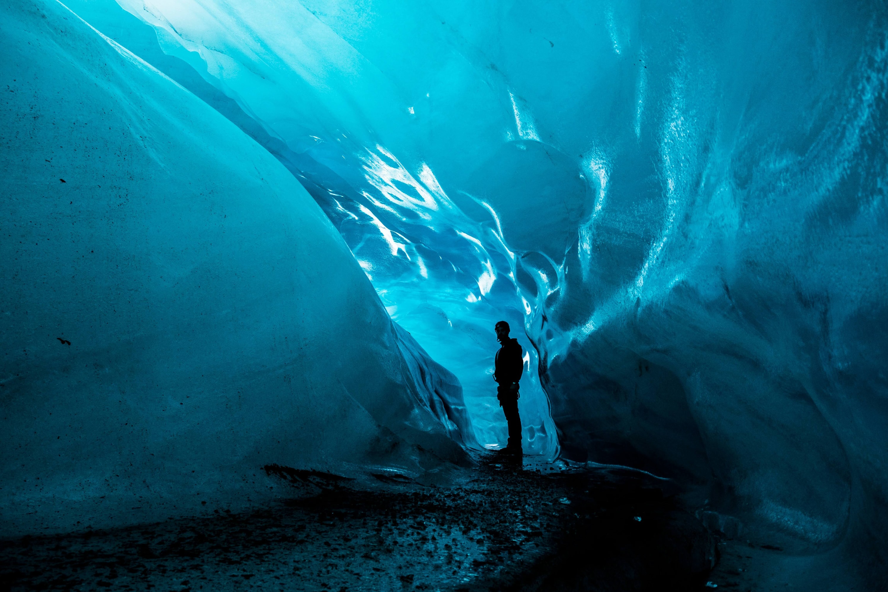Vatnajökull National Park, Iceland — walking through a glacier cave beneath Vatnajökull