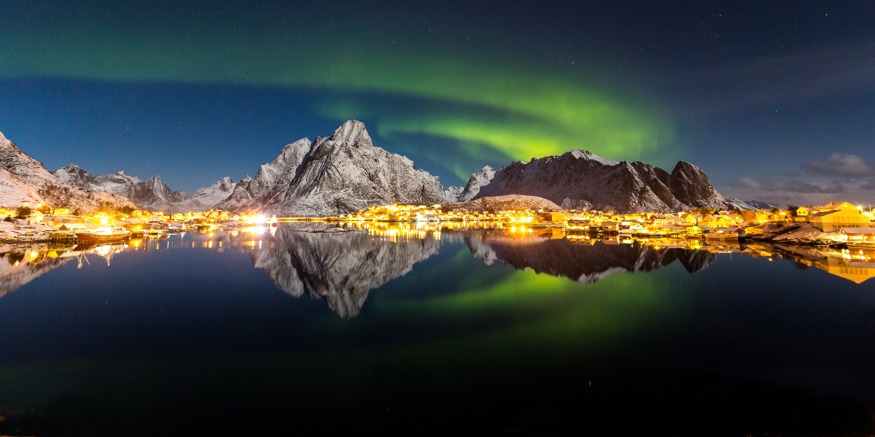 Reine, Lofoten Islands, Norway — the fishing village of Reine beneath the northern lights