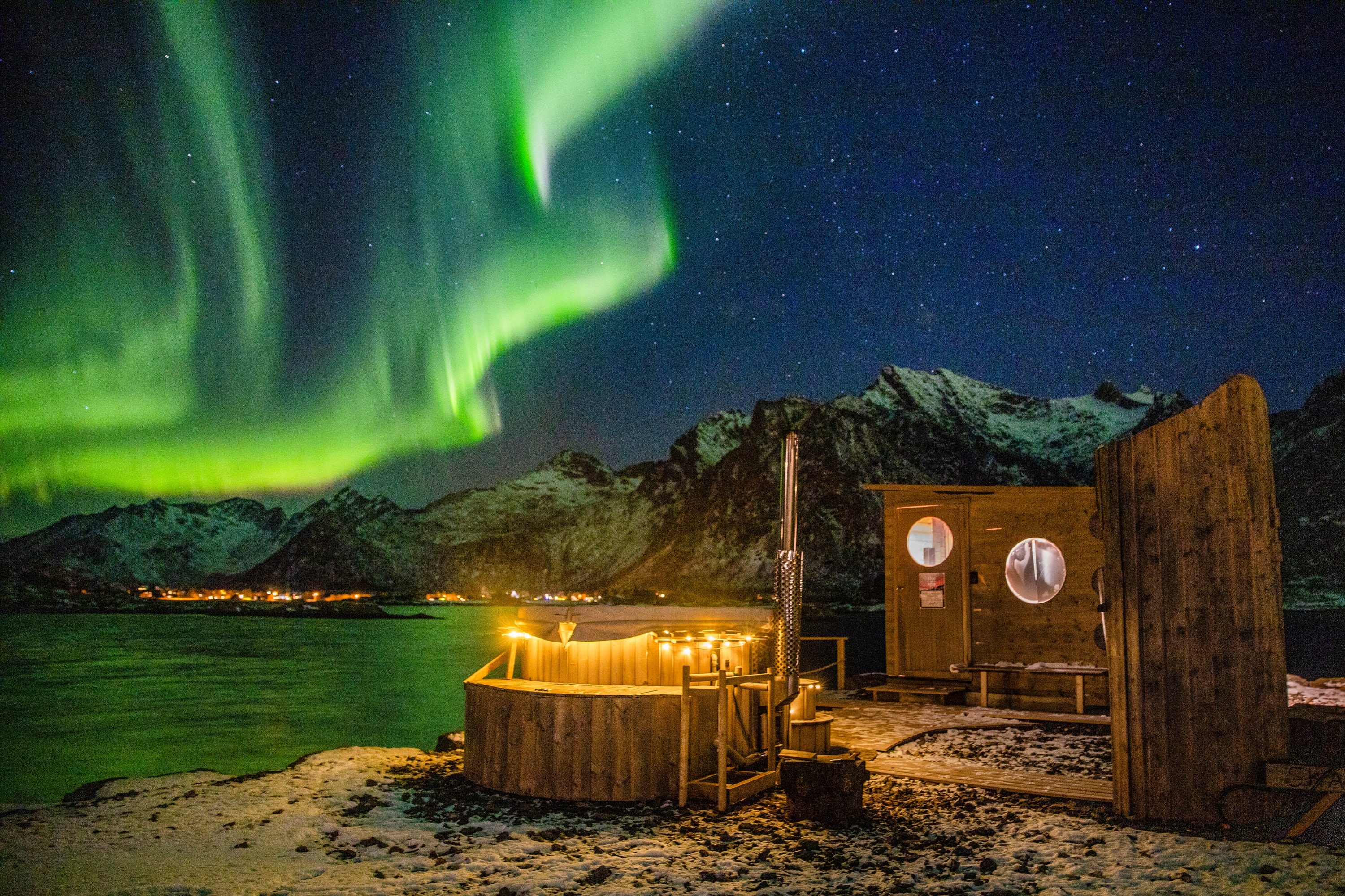 Lofoten Islands, Norway — the Skårungen sauna beneath the northern lights